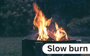 An image of flames in a fire pit with the caption ‘slow burn’ to illustrate the laissez-FIRE go-slow concept